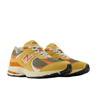 Tenis Unisex New Balance 2002R Amarillo Naranja Apricot vista par frontal